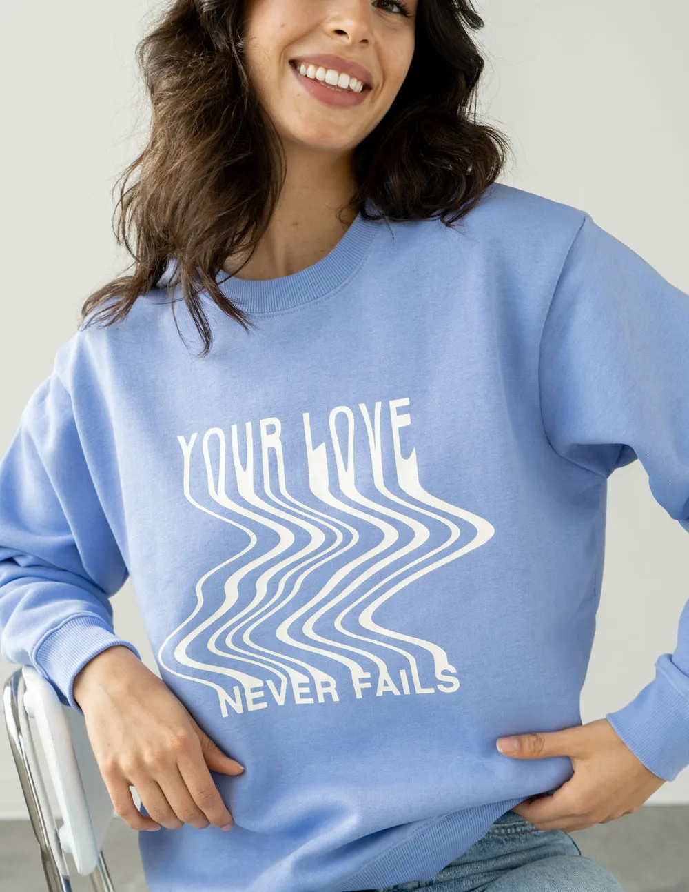 Love Never Fails Blue Unisex Crewneck