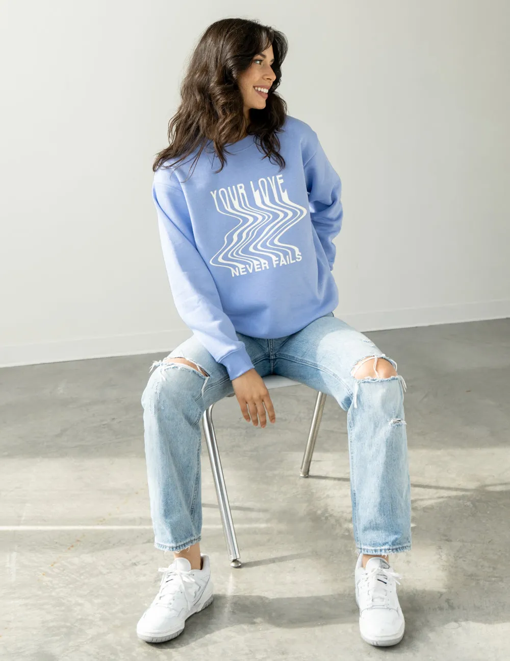 Love Never Fails Blue Unisex Crewneck