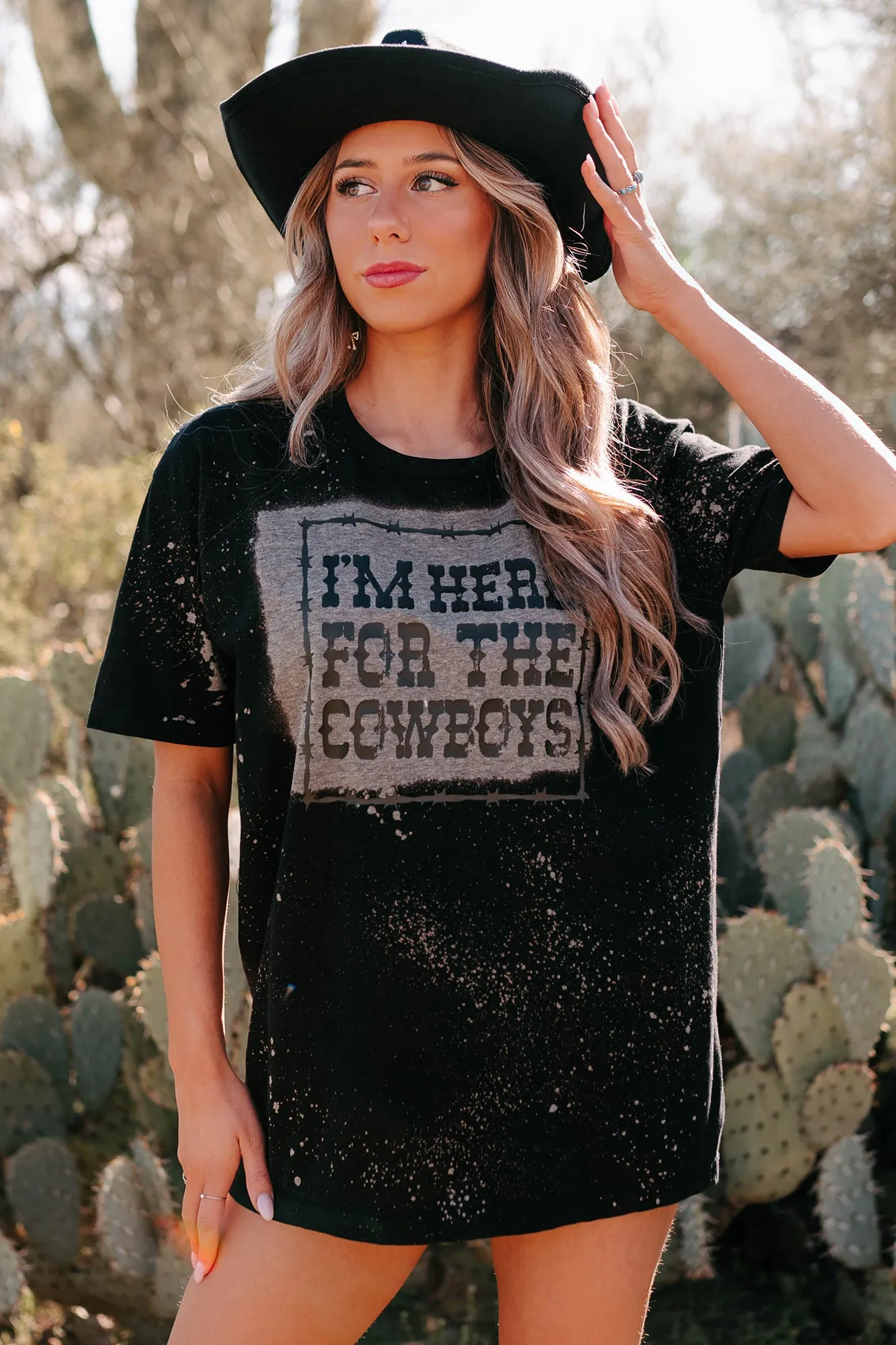 "I'm Here For The Cowboys" Bleached Graphic T-Shirt (Black) - Print On Demand